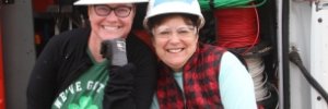 Corporate participants, smiling in hardhats, on a build in Nicaragua